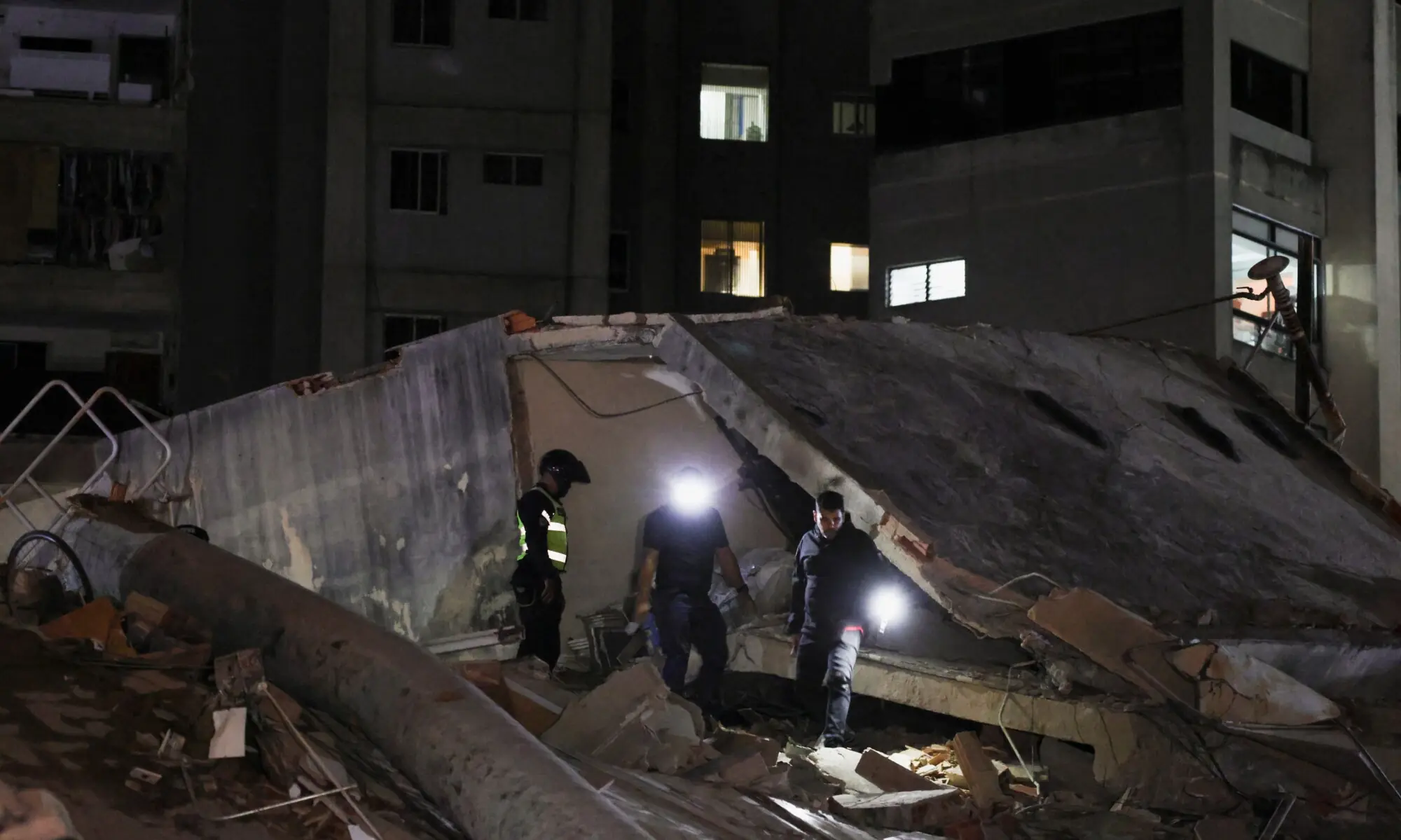 People inspect the site of a collapsed building after an earthquake in Caracas, Venezuela, June 24, 2026. &mdash; Reuters