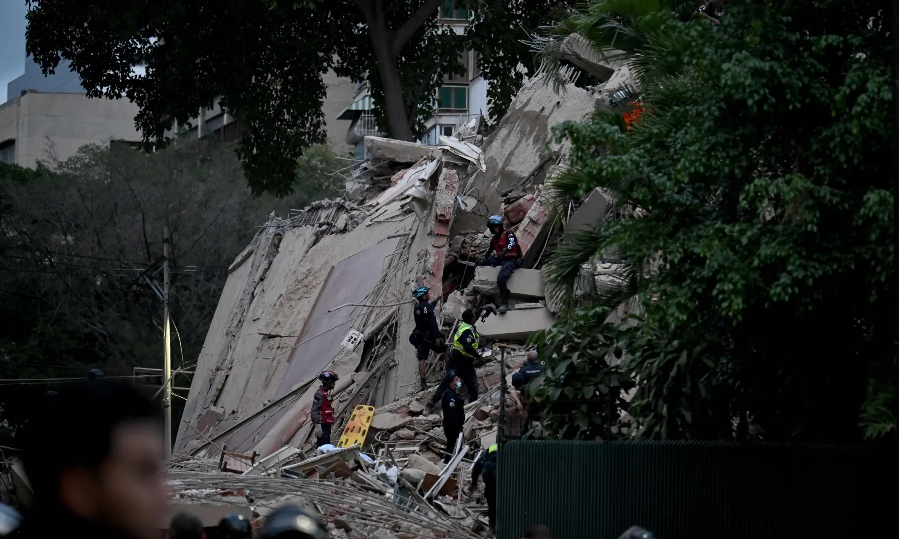  Rescuers search for victims in a collapsed building following an earthquake in Caracas on June 24, 2026. &mdash;AFP 