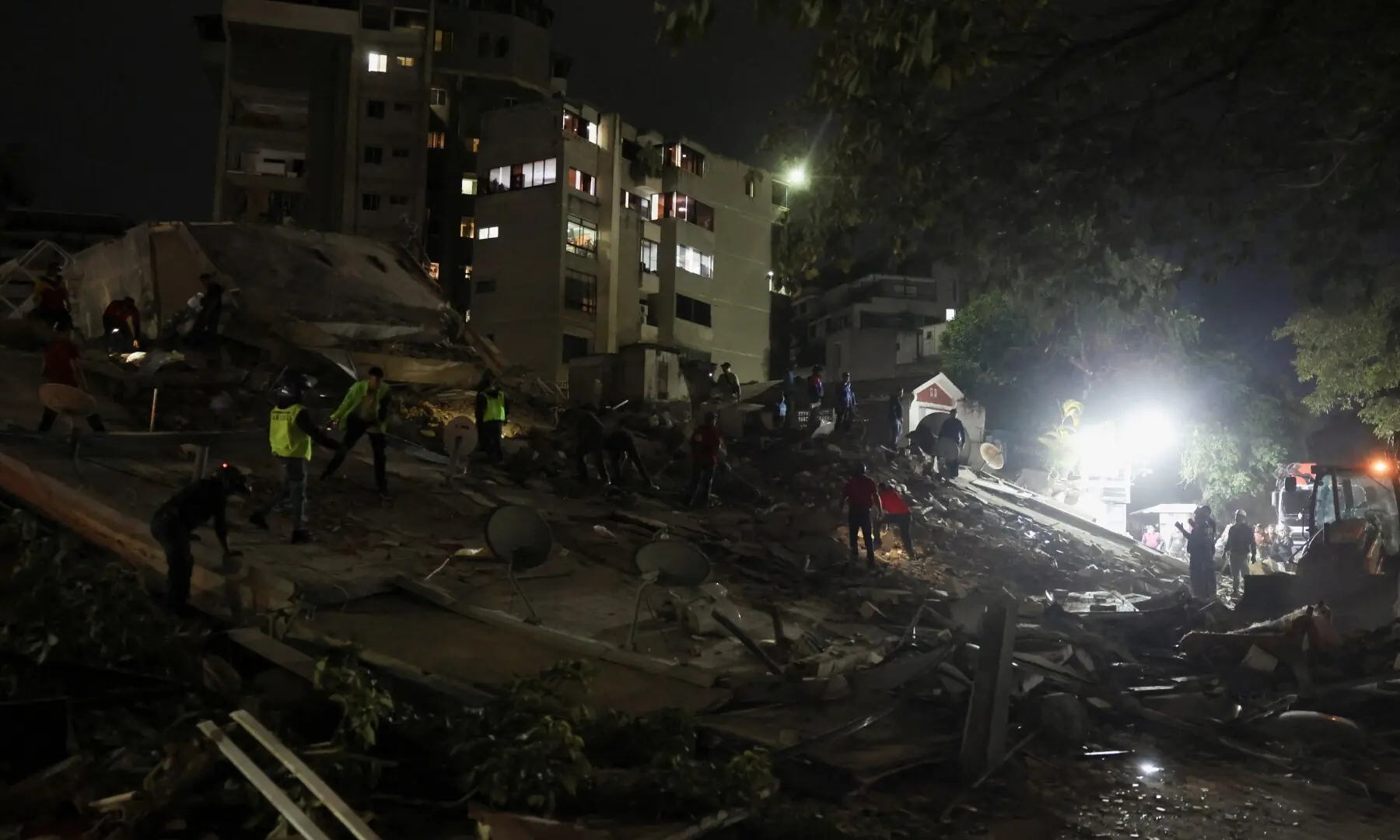 Emergency services work at the site of a collapsed building after an earthquake in Caracas, Venezuela, June 24, 2026. &mdash;Reuters