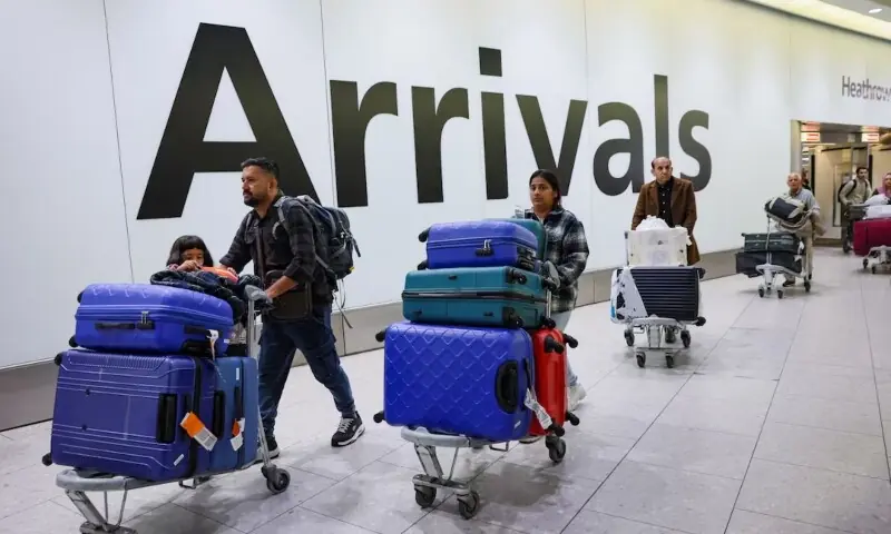 People with luggage arrive at Terminal 4 of Heathrow International Airport near London, the UK on March 22, 2025. &mdash; Reuters/File