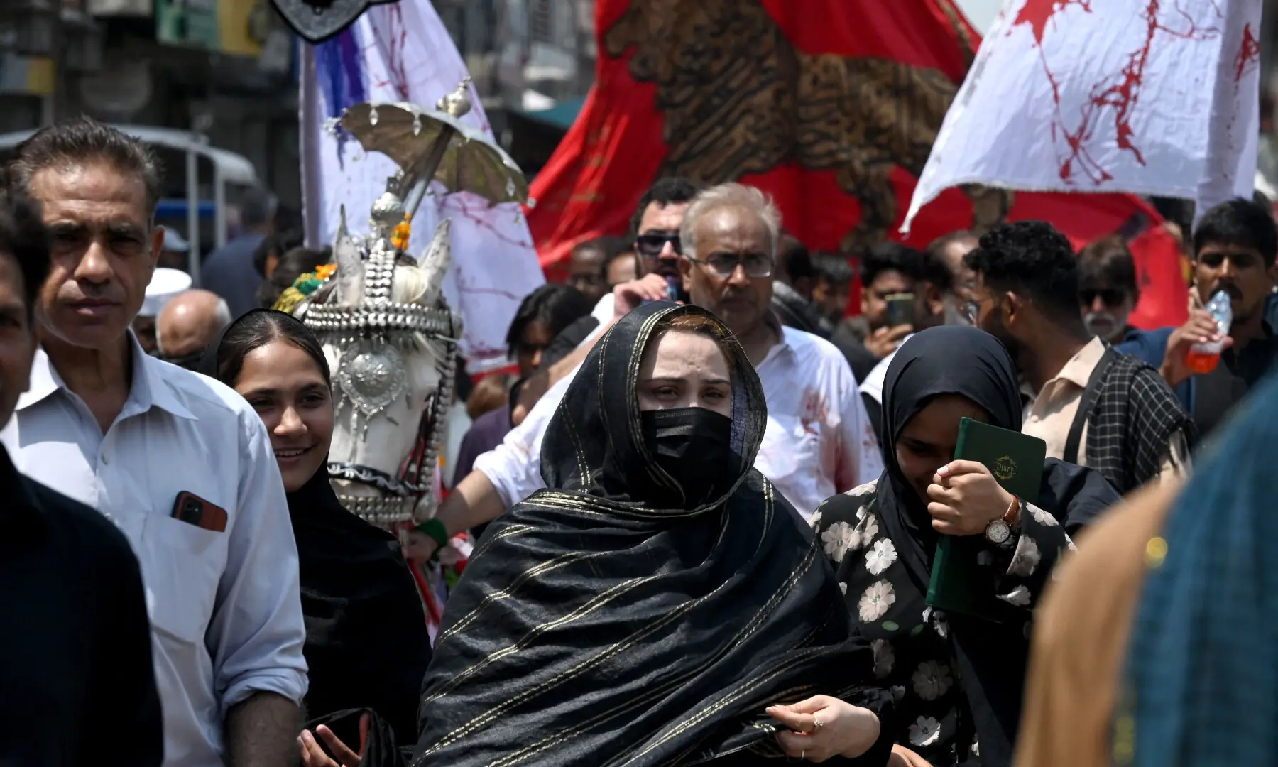 Muslims participate in a Muharram procession on the ninth day of Ashura in Peshawar on June 25, 2026. &mdash; AFP