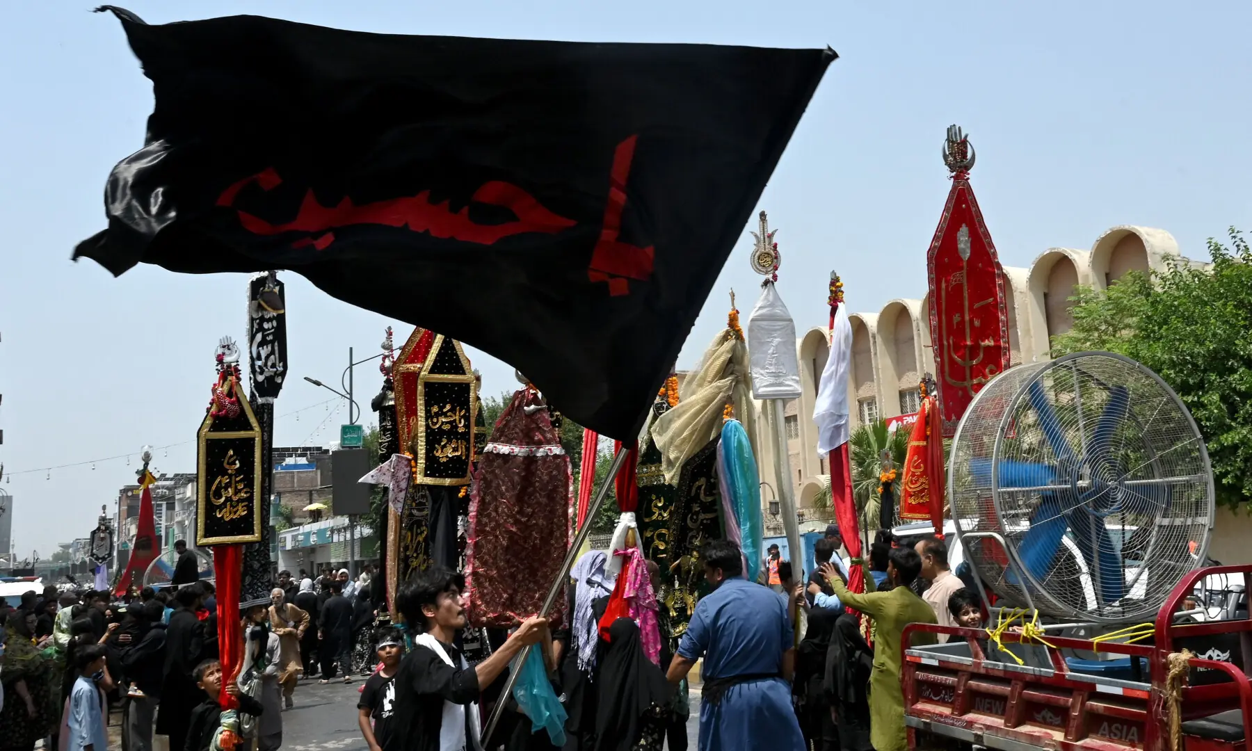 Muslims participate in a Muharram procession on the ninth day of Ashura in Peshawar on June 25, 2026. &mdash; AFP