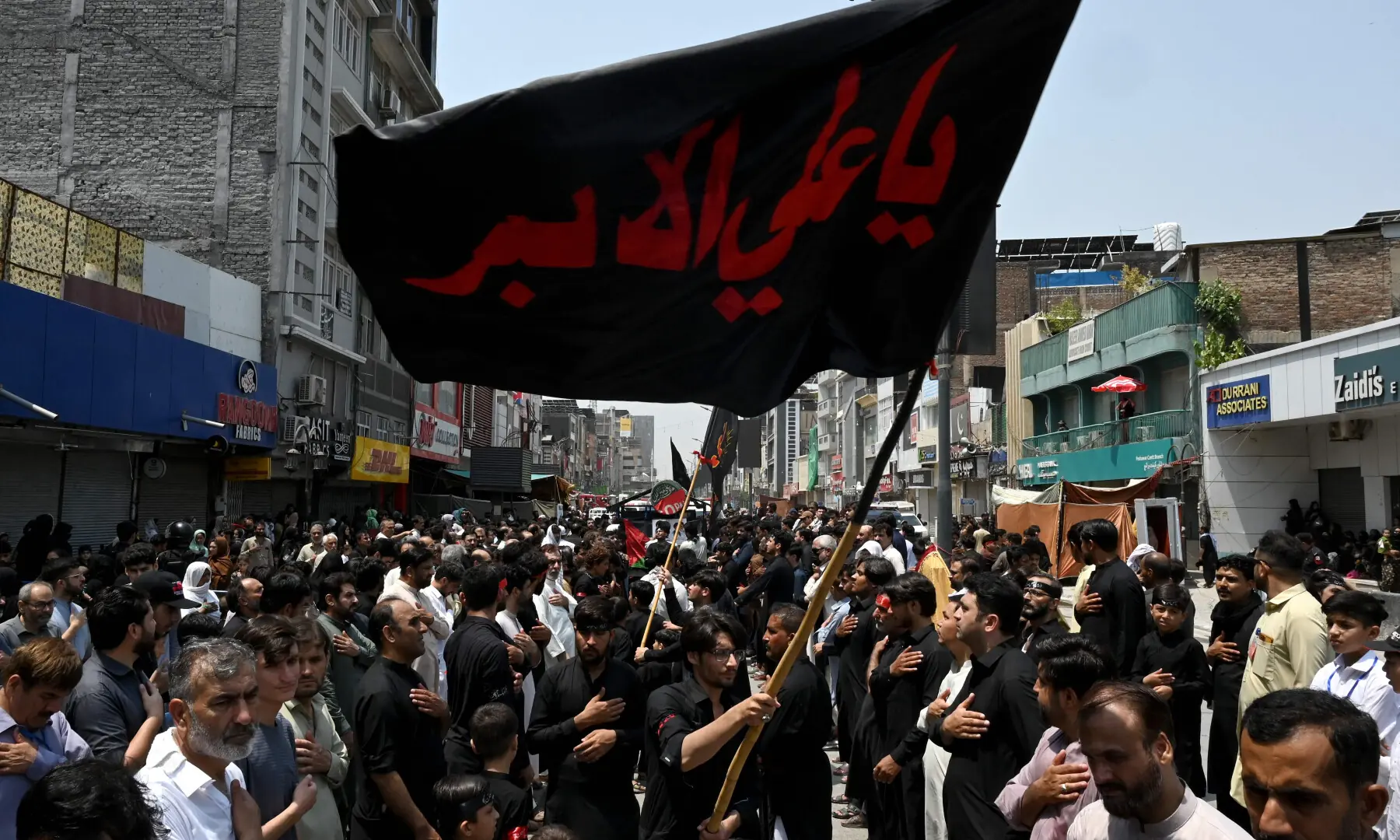 Muslims participate in a Muharram procession on the ninth day of Ashura in Peshawar on June 25, 2026. &mdash; AFP