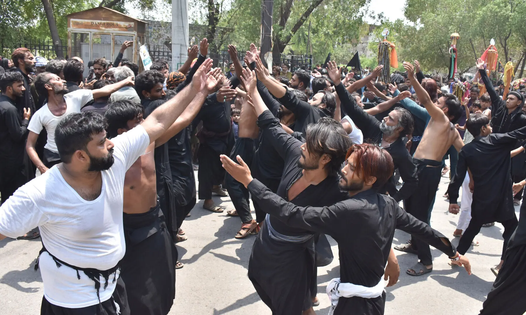 Mourners participate in a 9th Muharram procession at Qadria Chowk in Faisalabad. &mdash; Online photo by Haji Ibrahim