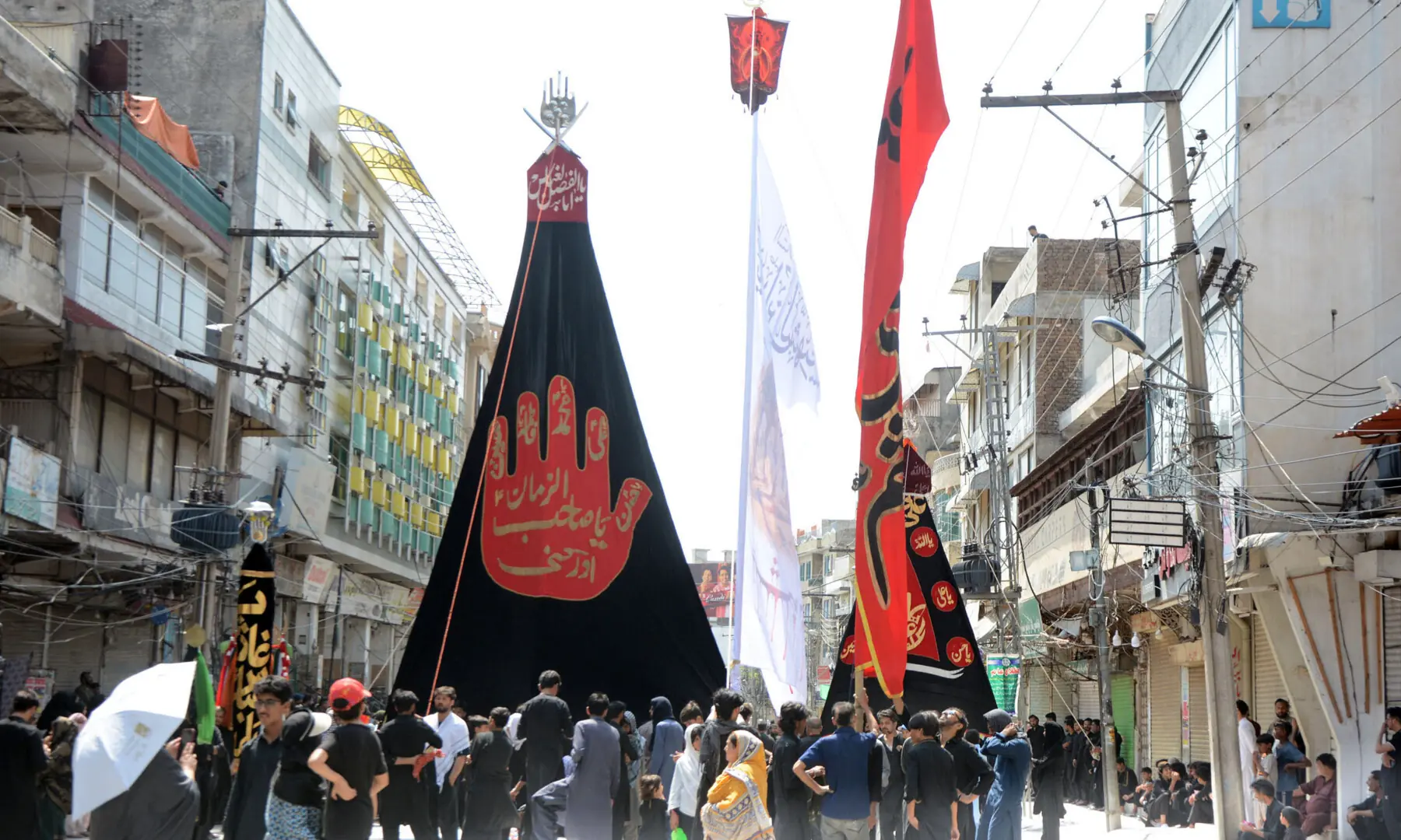 Mourners participate in 9th Muharram procession at Iqbal road in Rawalpindi. &mdash; Online photo by Raja Asim