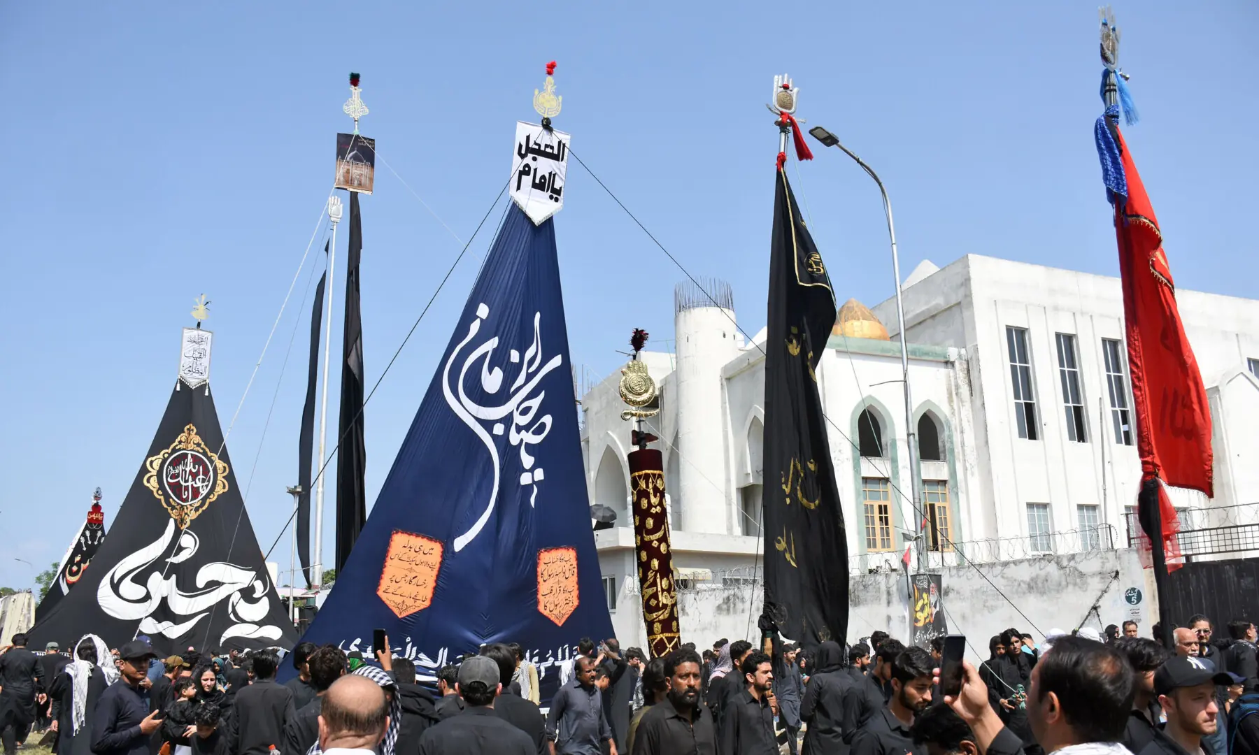 Muslims participate in a Muharram procession on the ninth day of Ashura at Markazi Asna Ashari Imambargah in G-6/2, Islamabad. &mdash; Online photo by Waseem Khan