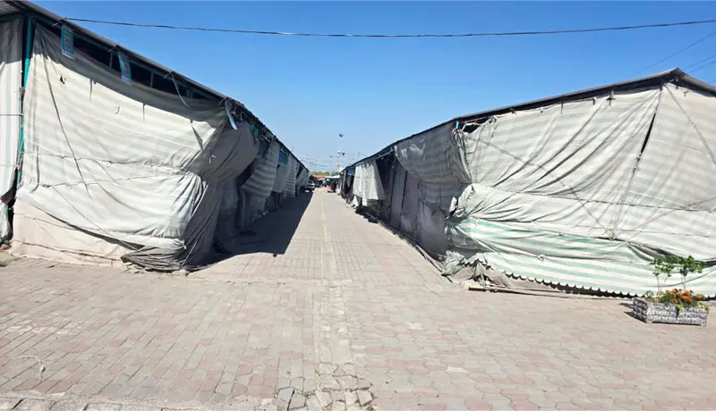 Tarpaulin-covered stalls pose a serious fire safety risk at the H-9 Weekly Bazaar in Islamabad on Thursday. &mdash; White Star