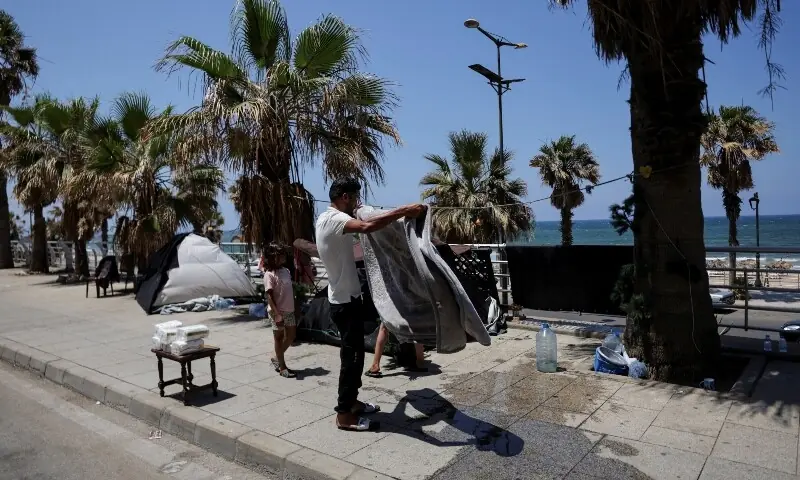 A man packs his belongings, after Beirut municipality instructed displaced residents living in tents on public sidewalks to move to official shelters, following the interim deal between the US and Iran, in Beirut, Lebanon, June 25, 2026. &mdash;Reuters
