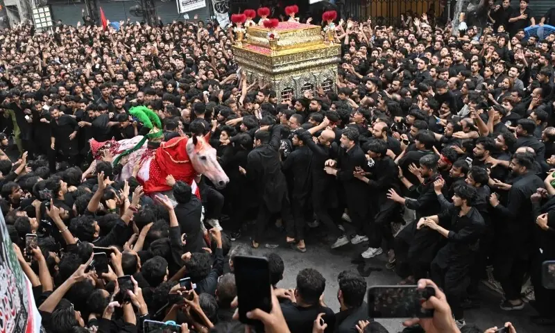 Mourners participate in a Muharram procession on the ninth day of Ashura in Lahore on June 25, 2026. &mdash; AFP