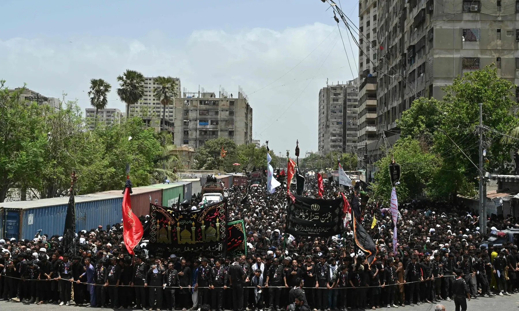 Mourners march during a religious procession marking Ashura on the tenth day of Muharram in Karachi on June 26, 2026. &mdash; AFP
