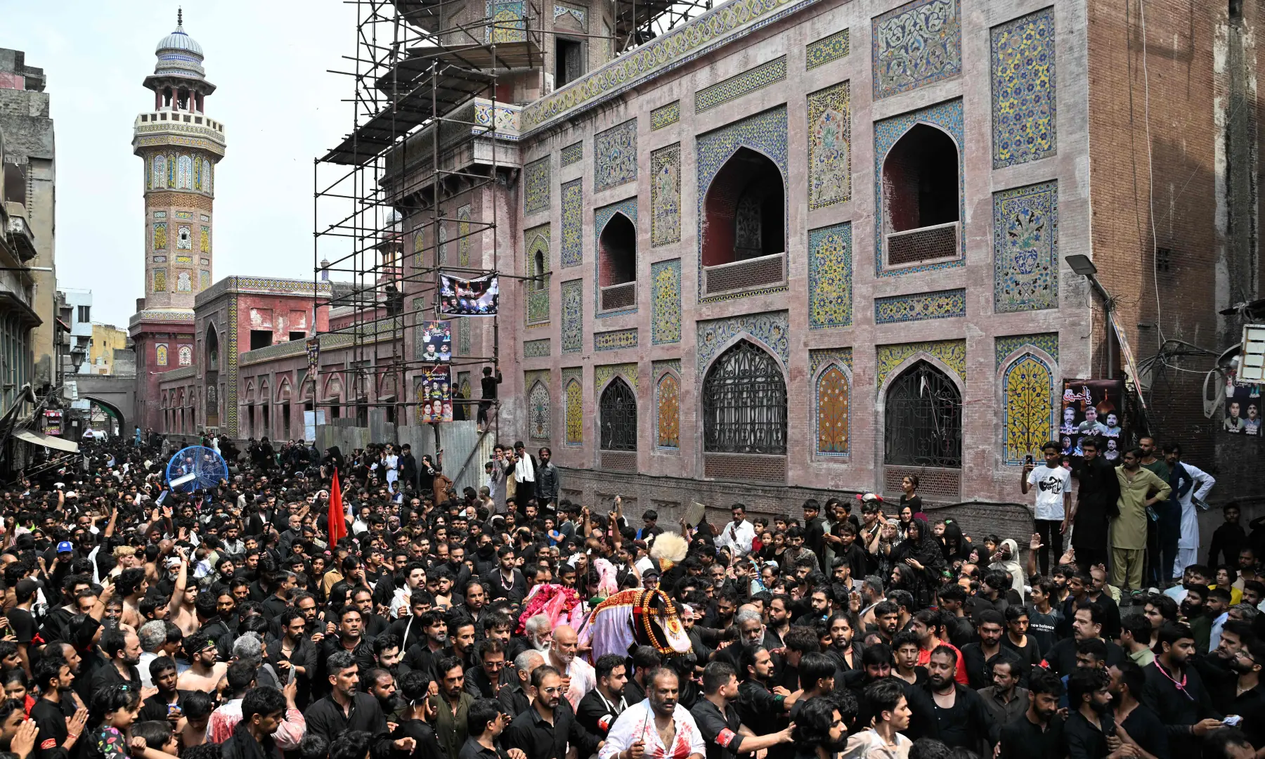 Mourners take part in a religious procession marking Ashura on the tenth day of Muharram in Lahore on June 26, 2026. &mdash; AFP