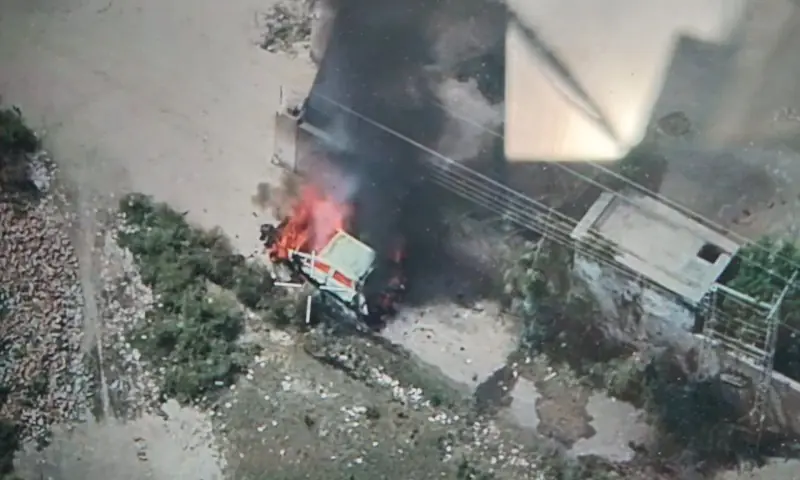 A drone view shows flames and smoke rising from a vehicle said to have been carrying a heavy cache of weapons in Bakakhel tehsil in Khyber Pakhtunkhwa's Bannu on June 26. &mdash; photo via author