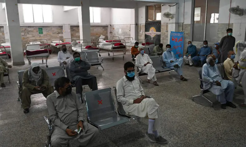 In this 2021 file photo, people wait for their turn to get the Sinovac vaccine at the Red Crescent vaccination centre in Rawalpindi. — AFP/File In this 2021 file photo, people wait for their turn to get the Sinovac vaccine at the Red Crescent vaccination centre in Rawalpindi. — AFP/File