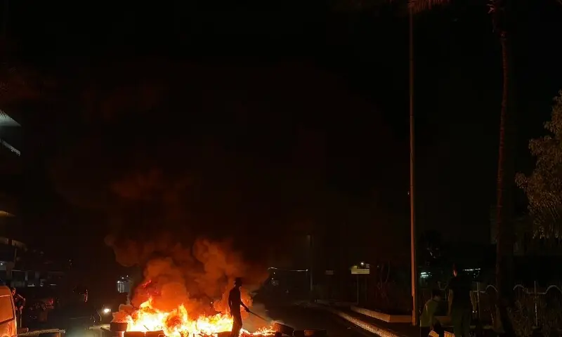 Hezbollah supporters block the old airport road in the southern suburbs of Beirut, with burning tires to protest against the trilateral agreement that was signed between the US, Israel and Lebanon on June 27, 2026. &mdash;AFP