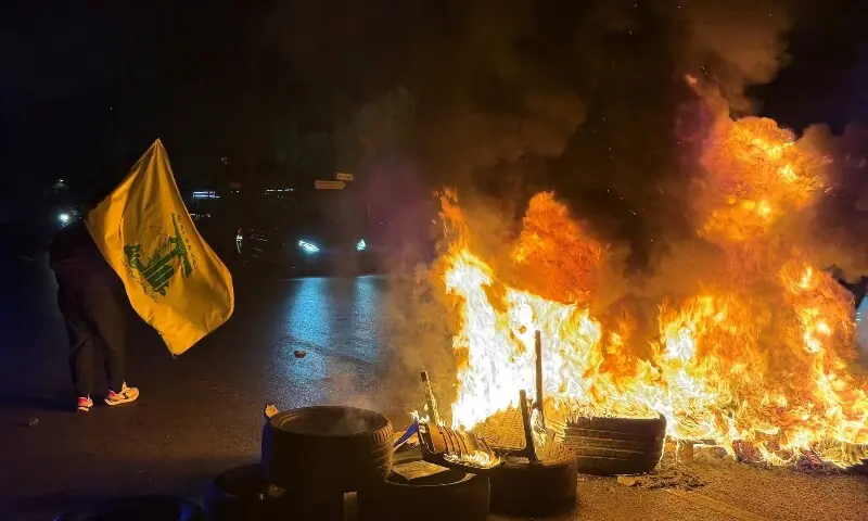 Hezbollah supporters block the old airport road in the southern suburbs of Beirut, with burning tires to protest against the trilateral agreement that was signed between the US, Israel and Lebanon on June 27, 2026. &mdash;AFP
