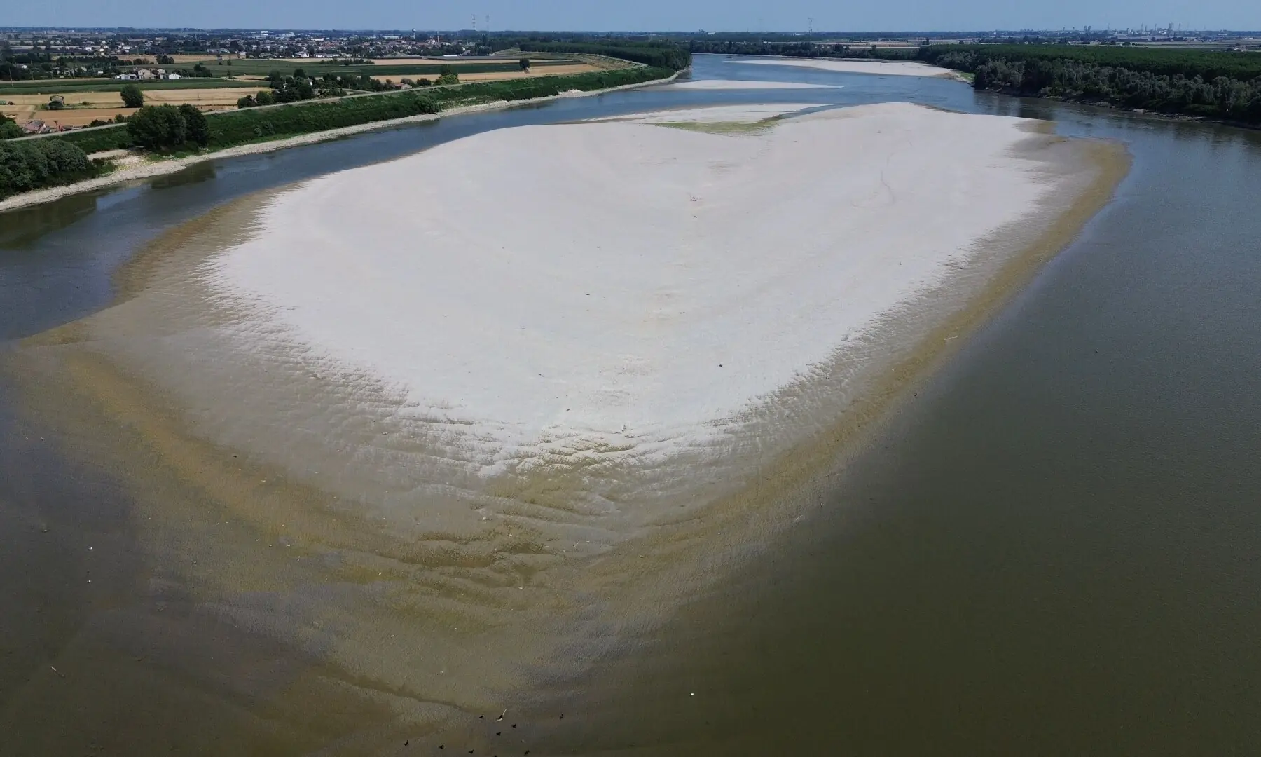 An aerial view shows a sandbar on the Po River at Pontelagoscuro, northeast Italy, on June 25, 2026. &mdash; AFP