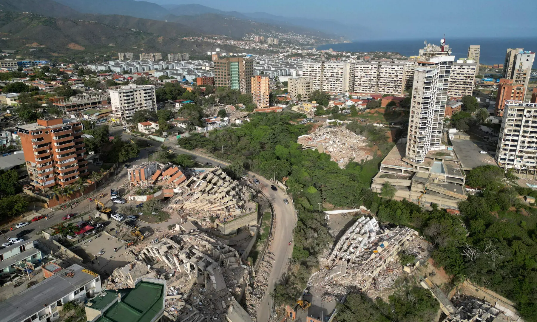 This aerial view shows collapsed buildings in Catia La Mar, La Guaira state, Venezuela, on June 27, 2026, following earthquakes that struck the region. &mdash; AFP