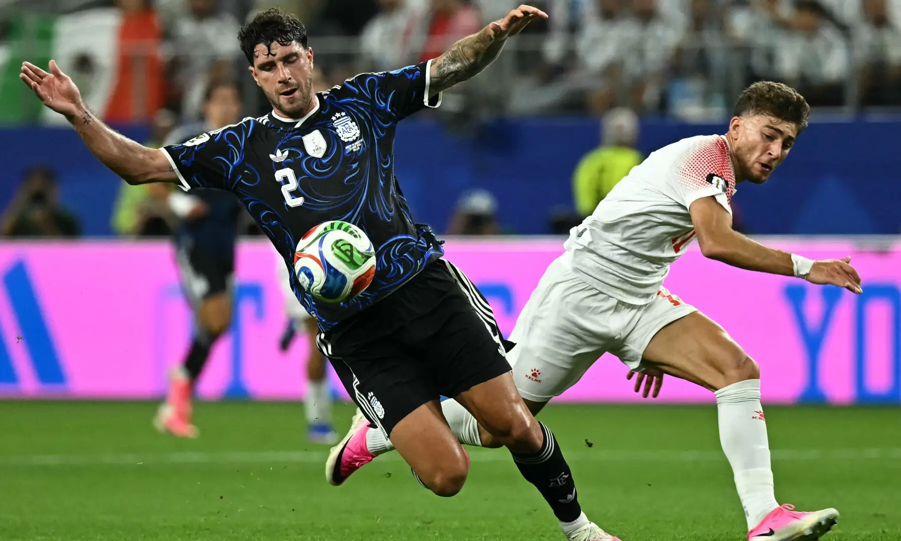 Argentina's defender #02 Marcos Senesi and Jordan's forward #11 Odeh Fakhoury fight for the ball during the 2026 World Cup Group J football match between Jordan and Argentina at the Dallas Stadium in Arlington on June 27, 2026. &mdash; AFP