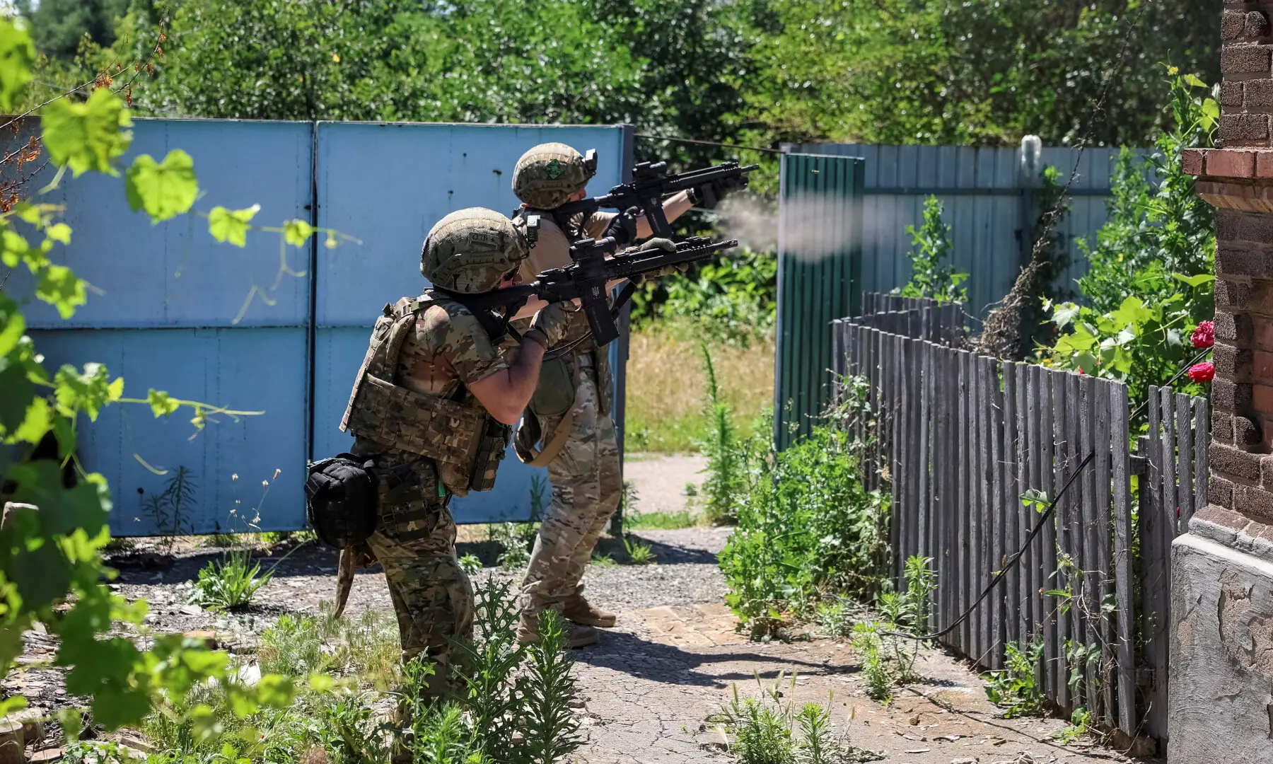 Servicemen of the consolidated Brigade &lsquo;Khyzhak&rsquo; of the Ukrainian Patrol Police Department fire assault rifles to shoot down a Russian drone during a mission to protect a road from Russian drones between frontline towns of Druzhkivka and Kostiantynivka, in the Donetsk region, Ukraine on June 24, 2026. &mdash; Reuters