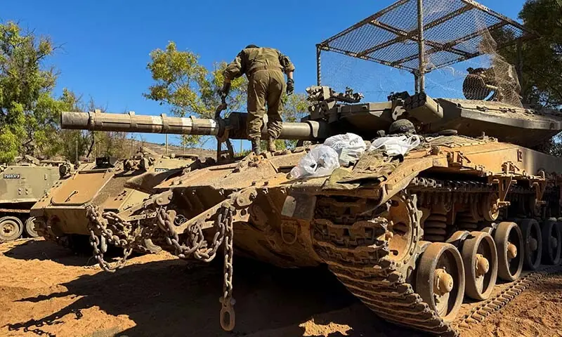 An Israeli soldier works on a tank on the Israeli side of the Israel-Lebanon border, after Israel and Lebanon signed a framework agreement following US-mediated talks, in northern Israel on June 28, 2026. &mdash; Reuters