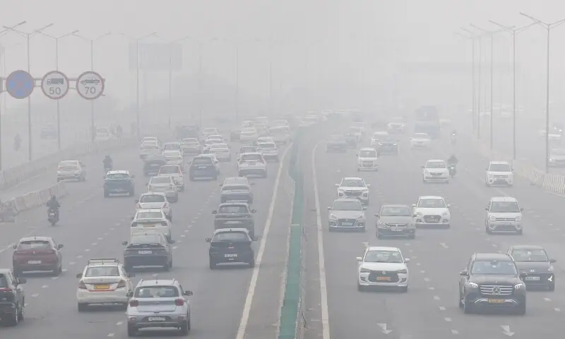 Traffic moves along a highway amidst air pollution in New Delhi, India, on December 18, 2025. &mdash; Reuters/File