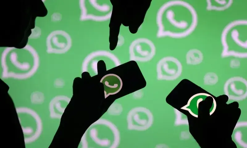 Men pose with smartphones in front of displayed Whatsapp logo in this illustration on September 14, 2017. — Reuters Men pose with smartphones in front of displayed Whatsapp logo in this illustration on September 14, 2017. — Reuters