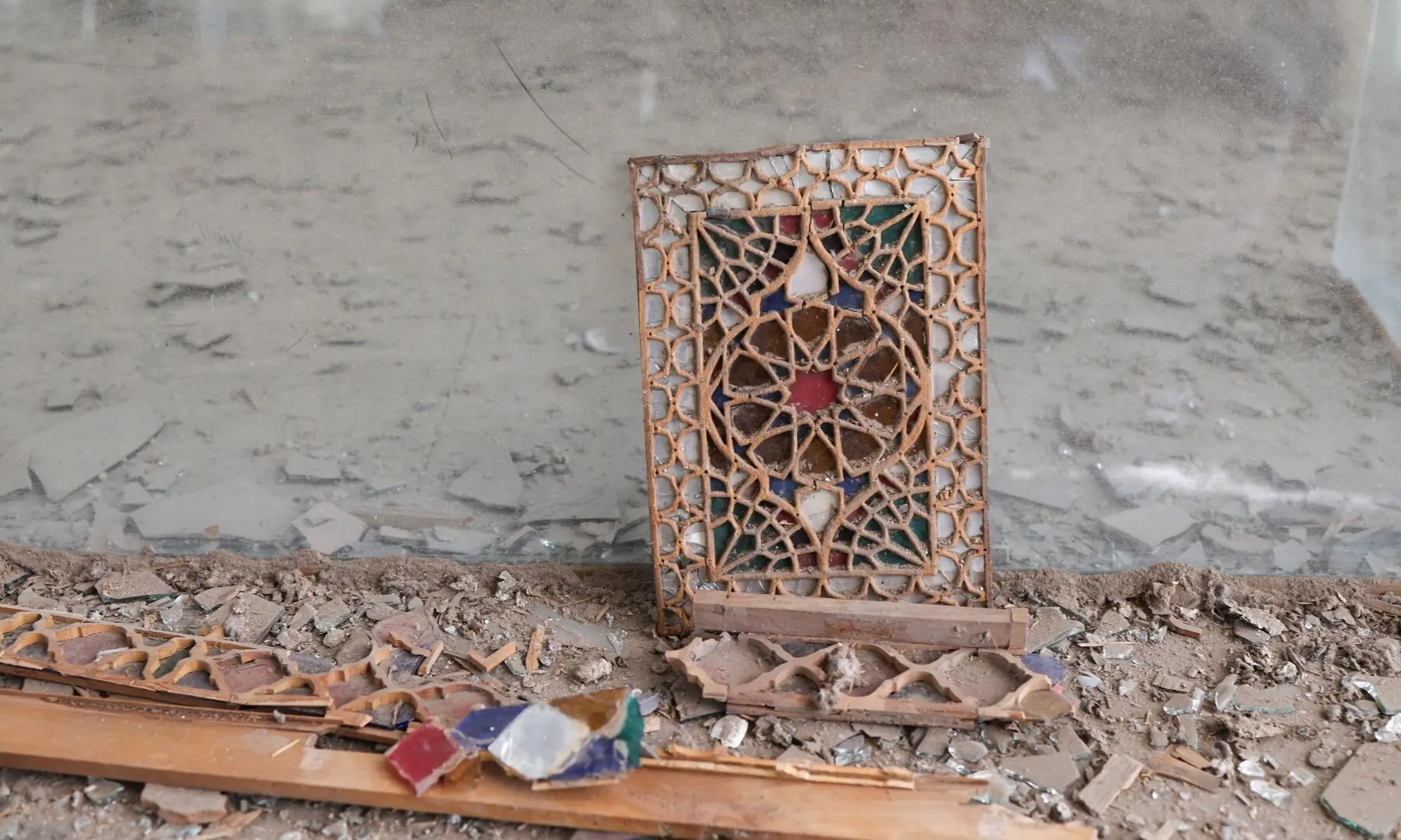 A damaged decorative panel lies amid debris on the floor inside the Hall of Mirrors (Talar-e Ayne) at Golestan Palace, a Unesco World Heritage site, amid the US-Israeli conflict with Iran, in Tehran, Iran, March 21, 2026. &mdash; Reuters