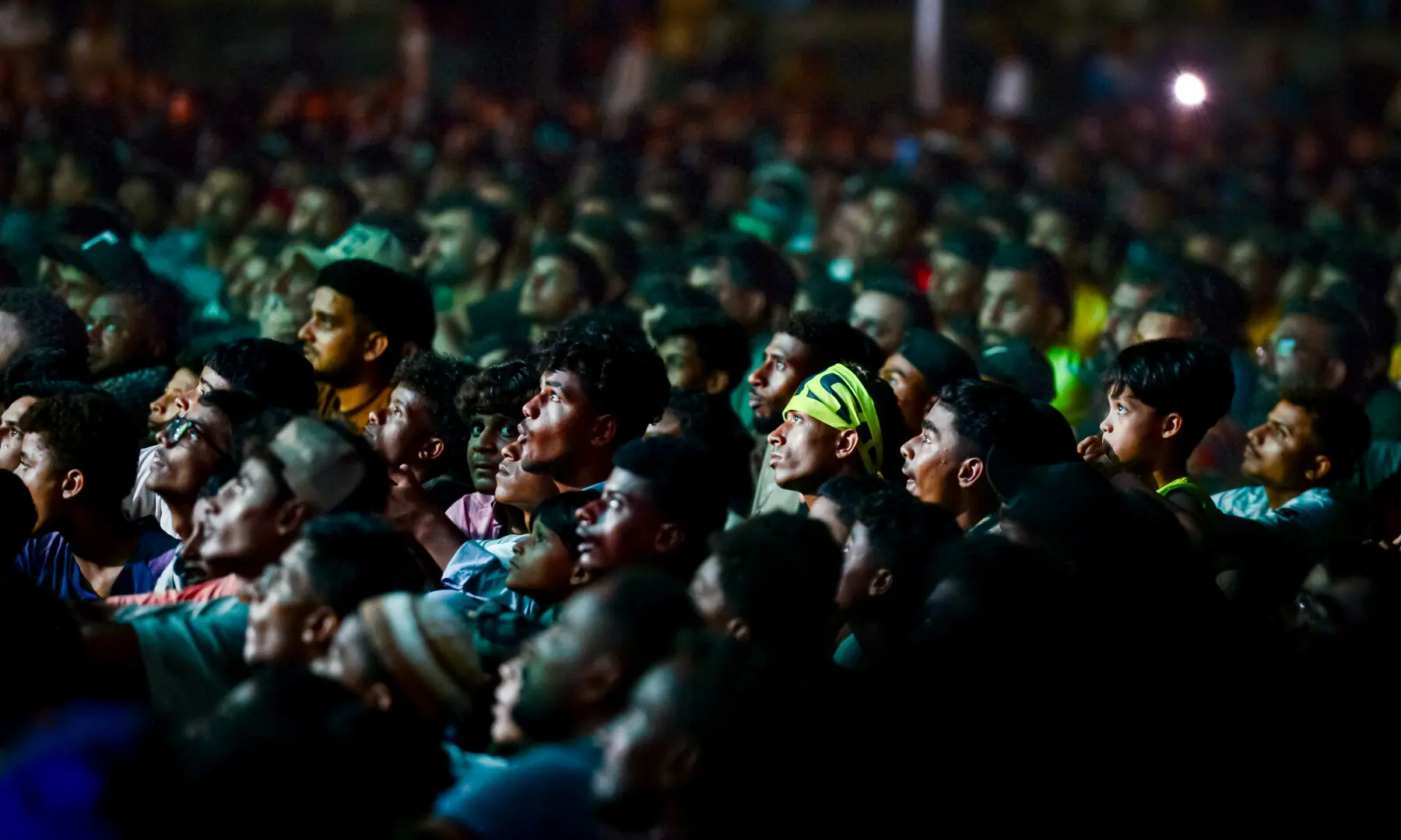 Spectators look intensely during a screening of the FIFA World Cup match between Brazil and Japan at Lyari International Football Stadium in Karachi on June 29, 2026. &mdash; Tahir Jamal