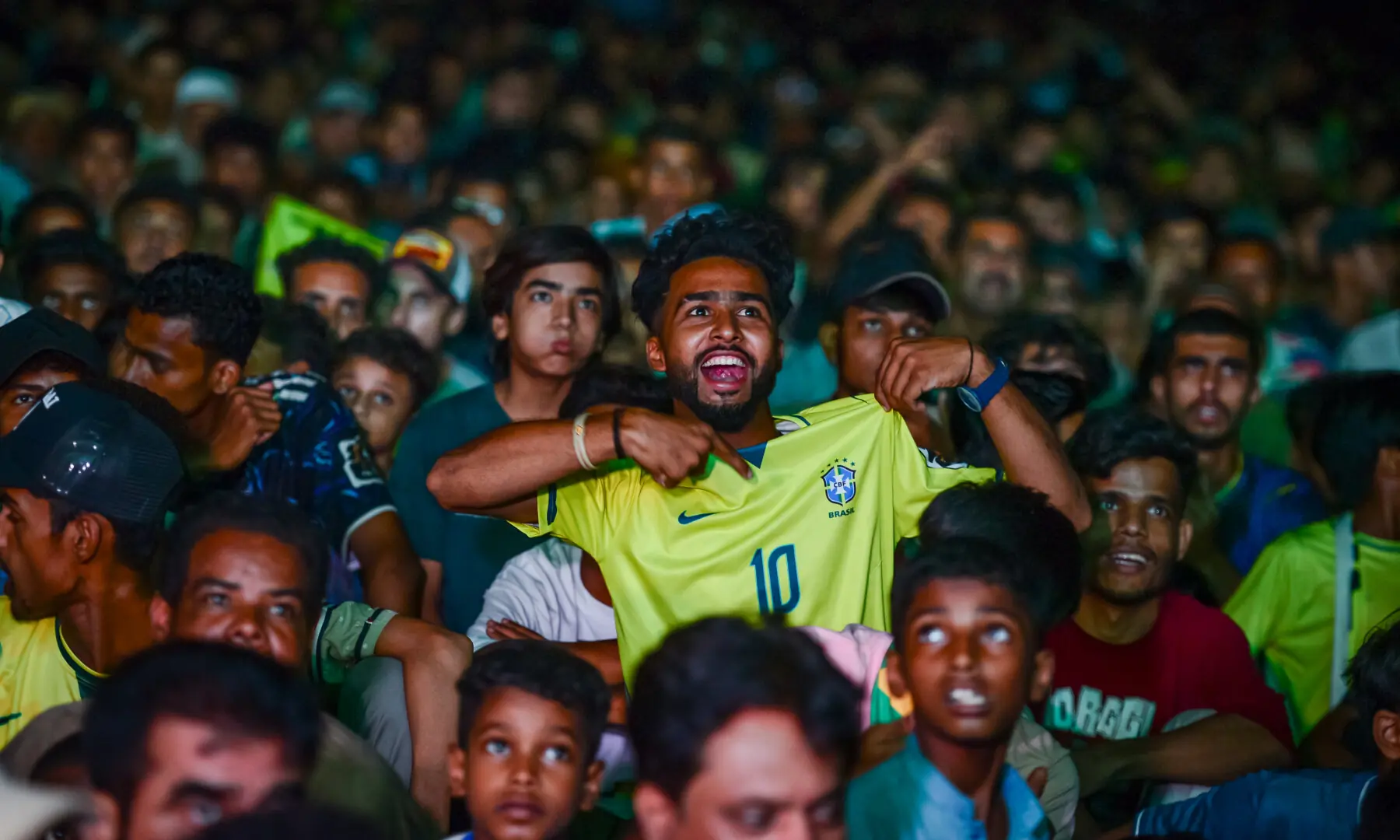 Football fans react during a screening of the FIFA World Cup match between Brazil and Japan at Lyari International Football Stadium in Karachi on June 29, 2026. &mdash; Tahir Jamal