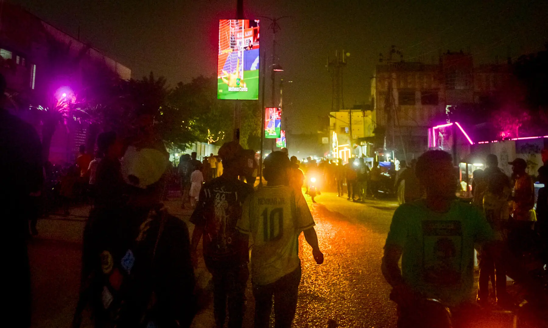 People return home after a screening of the FIFA World Cup match between Brazil and Japan at Lyari International Football Stadium in Karachi on June 29, 2026. &mdash; Tahir Jamal