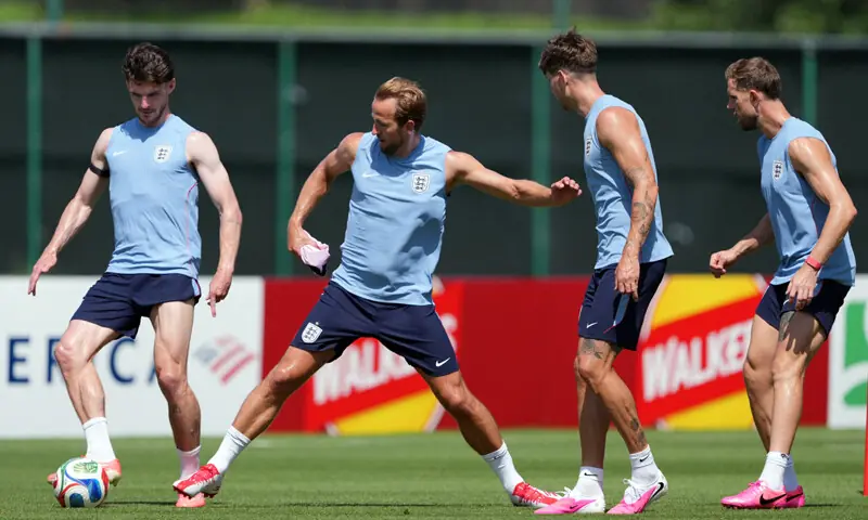 KANSAS CITY (Missouri): England’s Declan Rice (L) and Harry Kane (second L) fight for the ball during a training session at Swope Soccer Village on Tuesday.—Reuters KANSAS CITY (Missouri): England’s Declan Rice (L) and Harry Kane (second L) fight for the ball during a training session at Swope Soccer Village on Tuesday.—Reuters