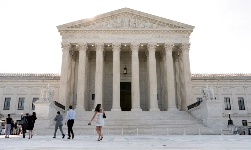 People walk in front of the Supreme Court building, as the court is set to issue the final rulings of its nine-month term, in Washington, DC, US, on June 30, 2026. &mdash; Reuters