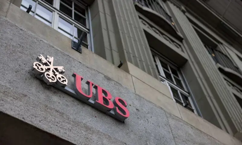 The UBS logo is pictured on a building next to the Federal Palace of Switzerland, in Bern, Switzerland, December 11, 2025. &mdash; Reuters