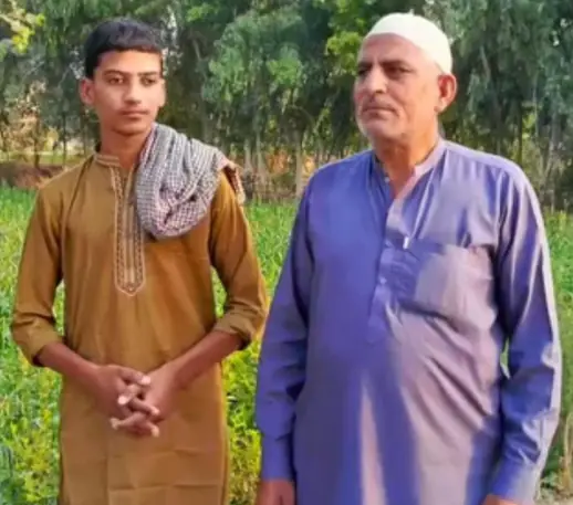 Muhammad Mansha Gondal (right) with his son Muhammad Abdul Basit. — Photograph provided by Gondal