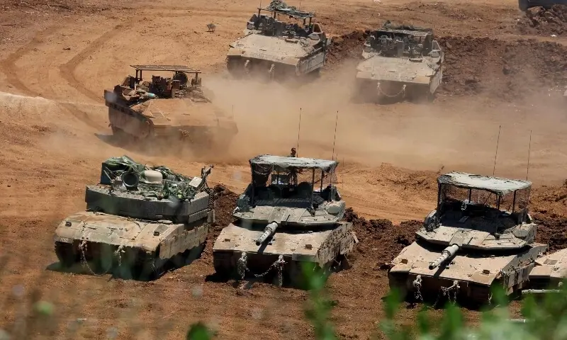 This picture taken from a position in the Upper Galilee in northern Israel shows Israeli army tanks positioned along the Israel-Lebanon border, on July 1, 2026. &mdash;AFP