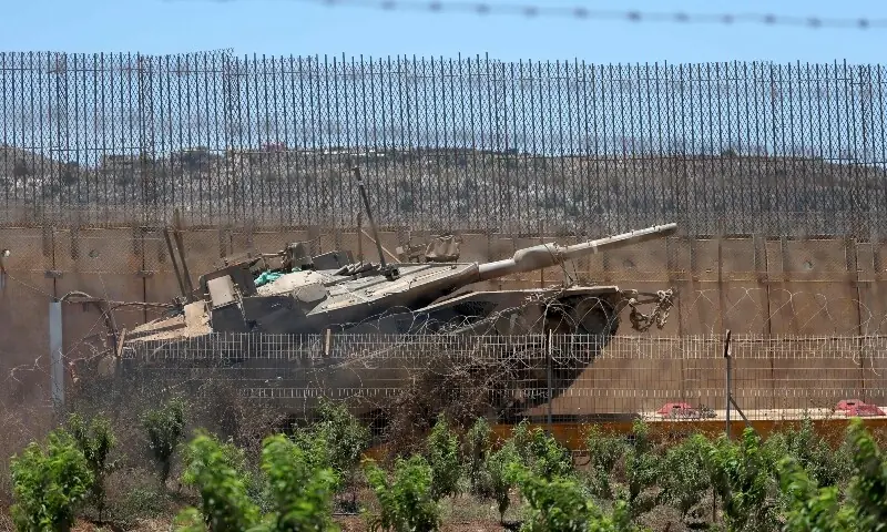 This picture taken from a position in the Upper Galilee in northern Israel shows Israeli army tanks positioned along the Israel-Lebanon border, on July 1, 2026. &mdash;AFP