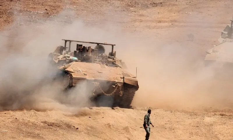This picture taken from a position in the Upper Galilee in northern Israel shows Israeli army tanks positioned along the Israel-Lebanon border, on July 1, 2026. &mdash;AFP