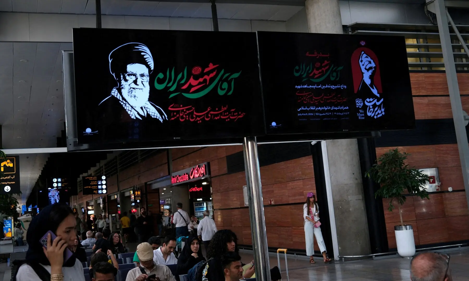 A digital screen with an image of Iran&rsquo;s assassinated Supreme Leader Ayatollah Ali Khamenei and a slogan reading &ldquo;Martyr of Iran&rdquo; at Imam Khomeini International Airport, ahead of the farewell ceremony for Ali Khamenei, in Tehran, Iran, July 1, 2026. &mdash; Reuters