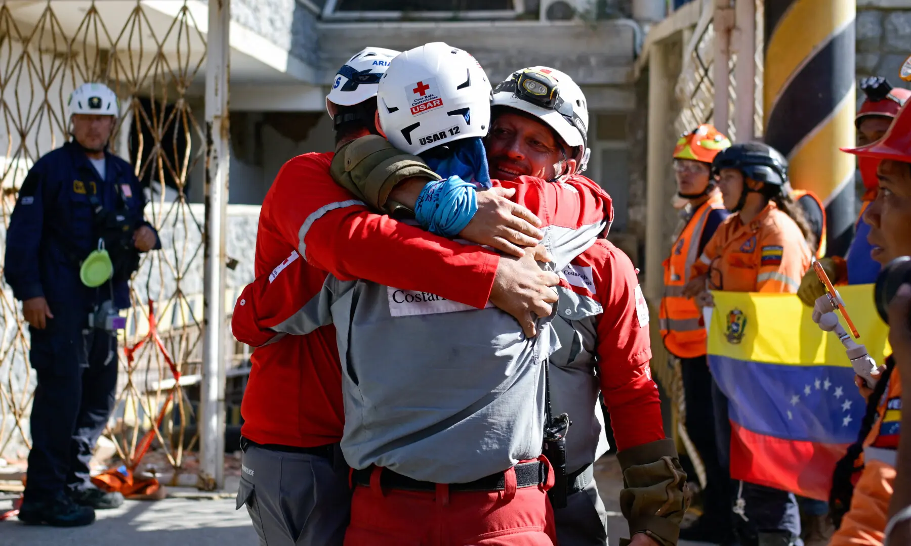 Rescue workers hug themselves after pulling out survivor Hernan Alberto Gil, who was trapped for over a week following June 24 earthquakes, from a collapsed mall in La Guaira, Venezuela, on July 2, 2026. — Reuters Rescue workers hug themselves after pulling out survivor Hernan Alberto Gil, who was trapped for over a week following June 24 earthquakes, from a collapsed mall in La Guaira, Venezuela, on July 2, 2026. — Reuters