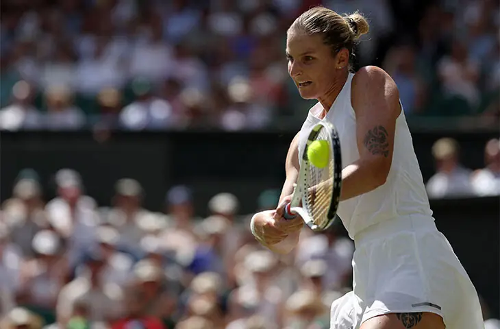 LONDON: Czech Republic&rsquo;s Karolina Pliskova plays a return against Iga Swiatek of Poland during their Wimbledon match at The All England Lawn Tennis and Croquet Club on Thursday.&mdash;AFP