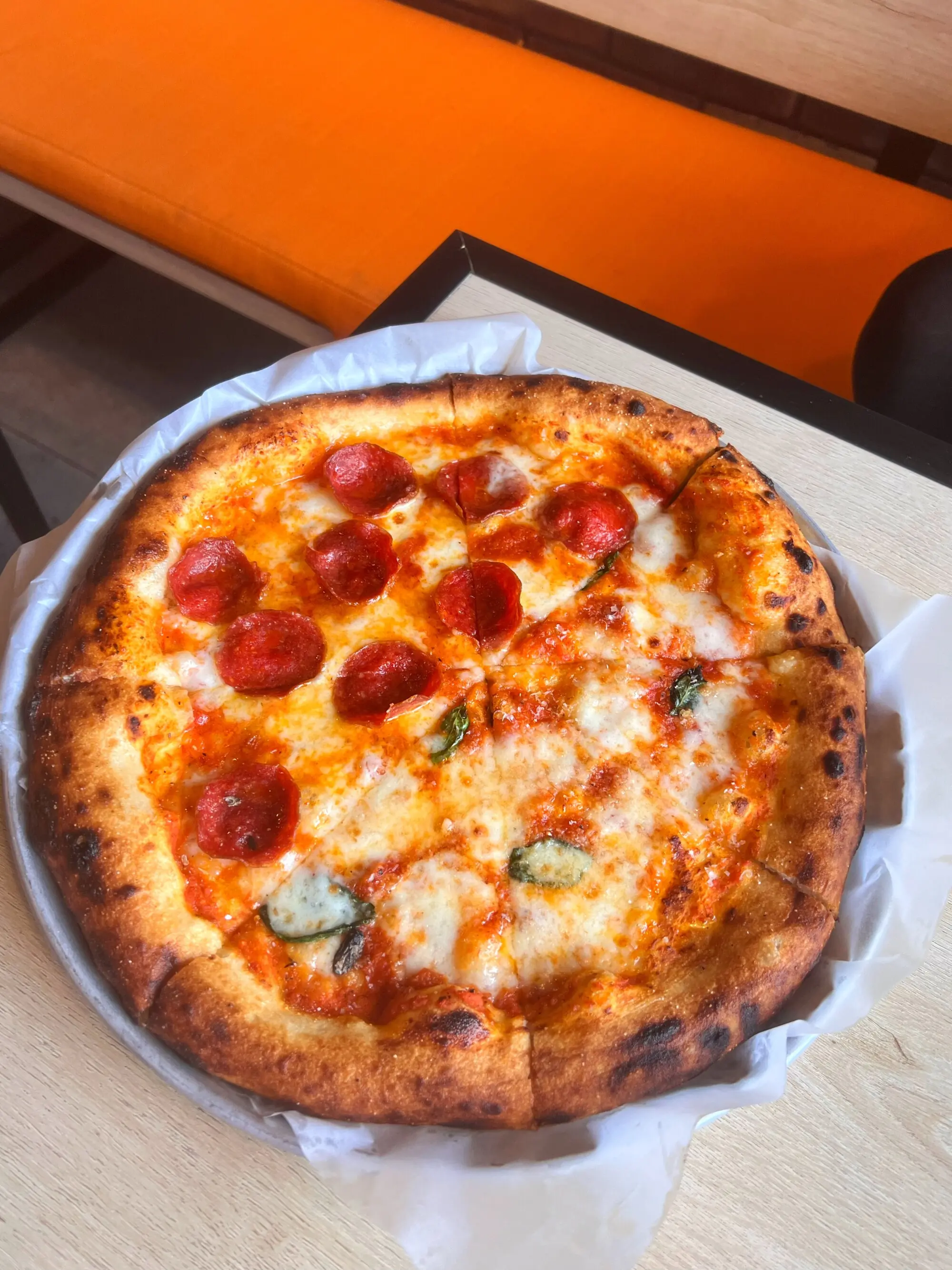 The order that arrived first: pepperoni with hot honey and margherita pizza (half and half).