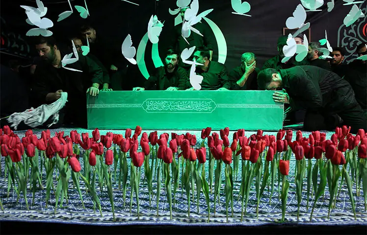 TEHRAN: Mourners gather around the coffin of late supreme leader Ayatollah Ali Khamenei ahead of his funeral.—AFP TEHRAN: Mourners gather around the coffin of late supreme leader Ayatollah Ali Khamenei ahead of his funeral.—AFP