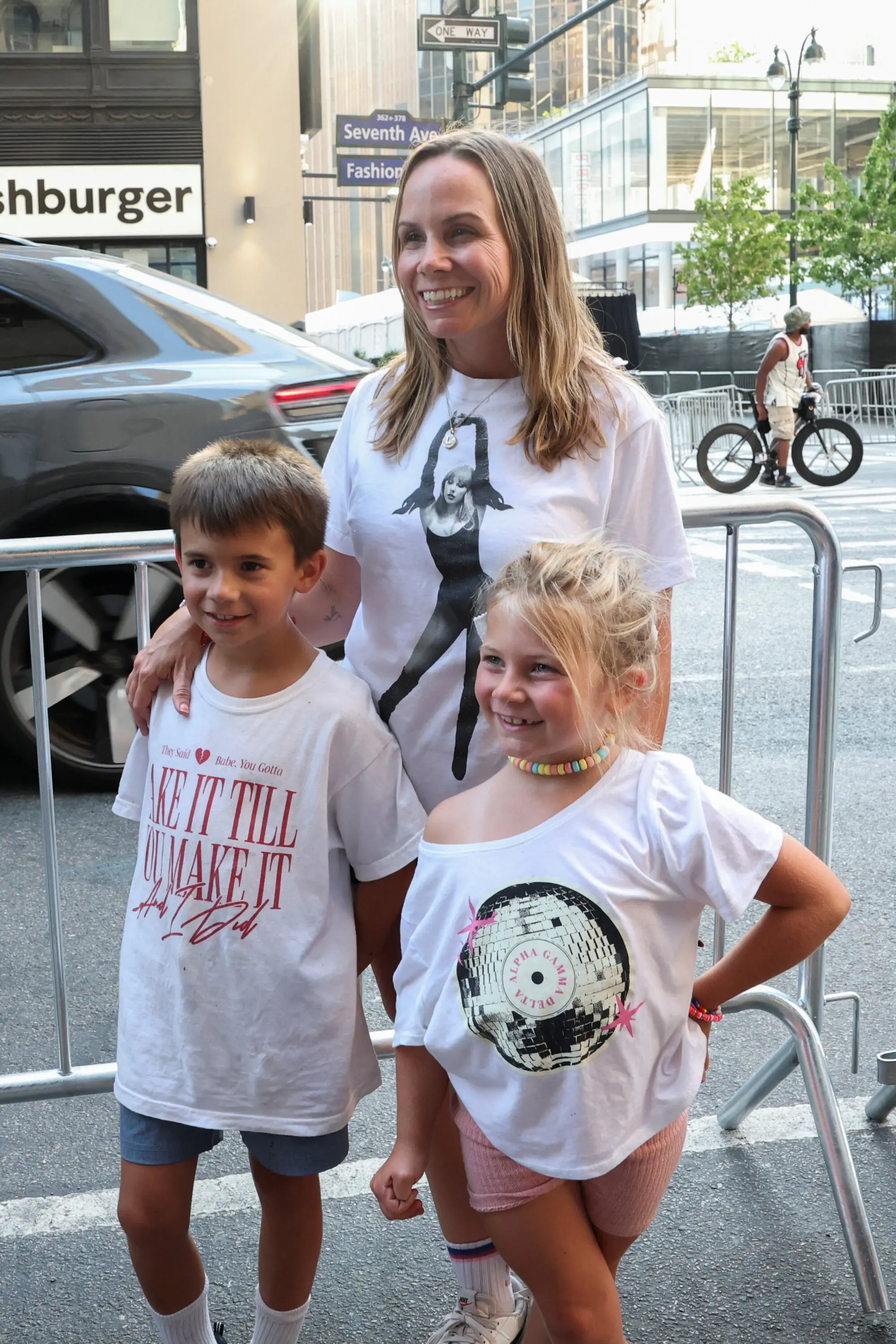A family of Swifties outside the wedding venue. Photo: Reuters