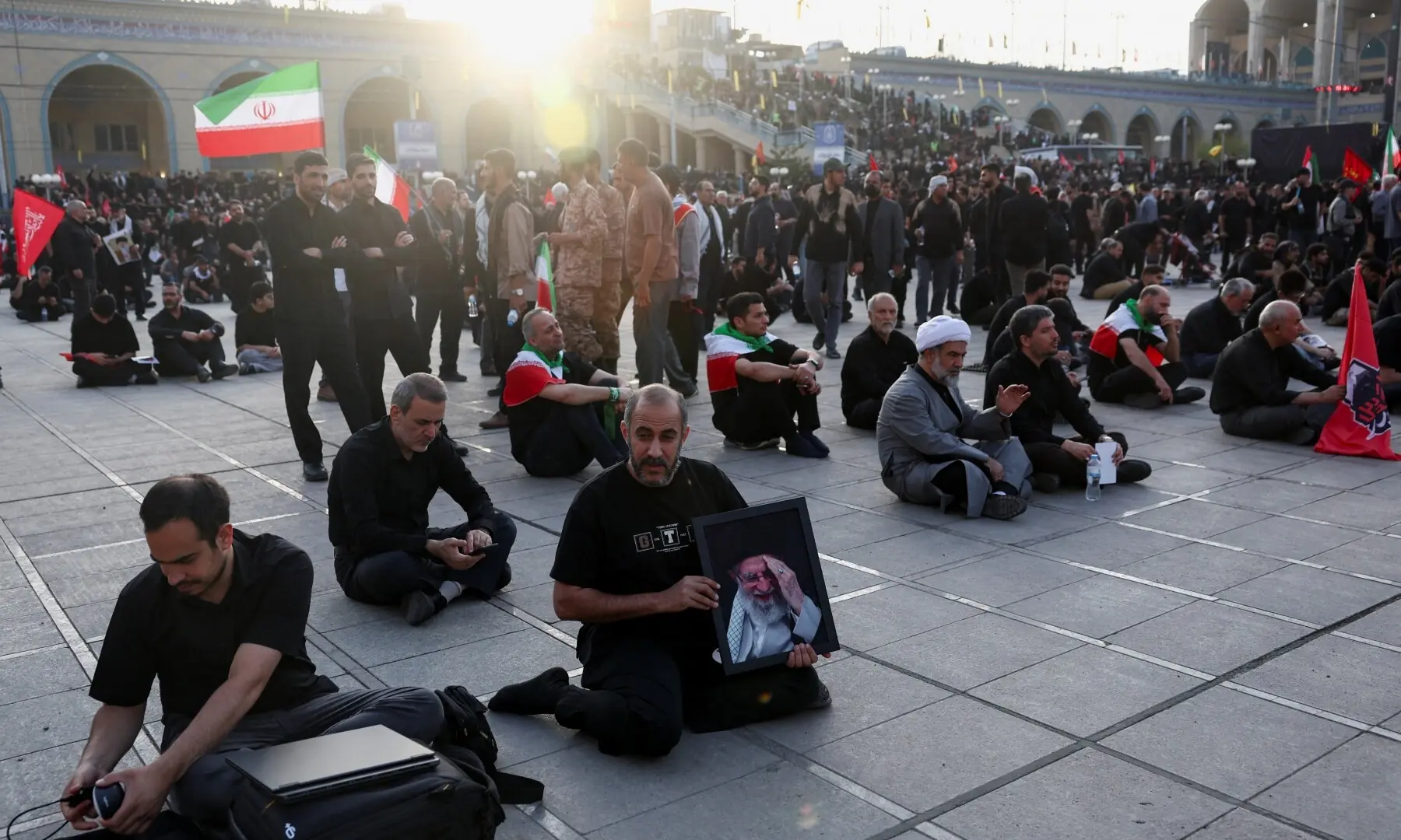 People gather on the day of a public farewell ceremony to pay their respects to late Supreme Leader Ayatollah Ali Khamenei, who was killed on February 28 in Israeli and US airstrikes, at the Imam Khomeini Grand Mosalla, in Tehran, Iran on July 4, 2026. &mdash; Reuters
