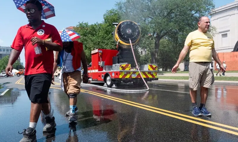 A man stands in the spray of water during a temporary closure of The Great American State Fair due to heat on the National Mall in Washington, DC, US, July 3, 2026. —Reuters A man stands in the spray of water during a temporary closure of The Great American State Fair due to heat on the National Mall in Washington, DC, US, July 3, 2026. —Reuters