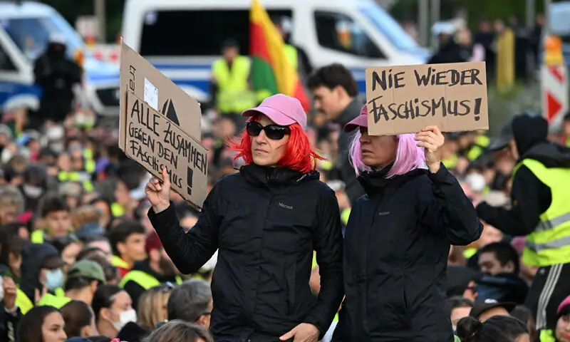 Protesters hold up placards reading ‘All together against fascism’ near the venue of the AfD congress in Erfurt.—AFP Protesters hold up placards reading ‘All together against fascism’ near the venue of the AfD congress in Erfurt.—AFP