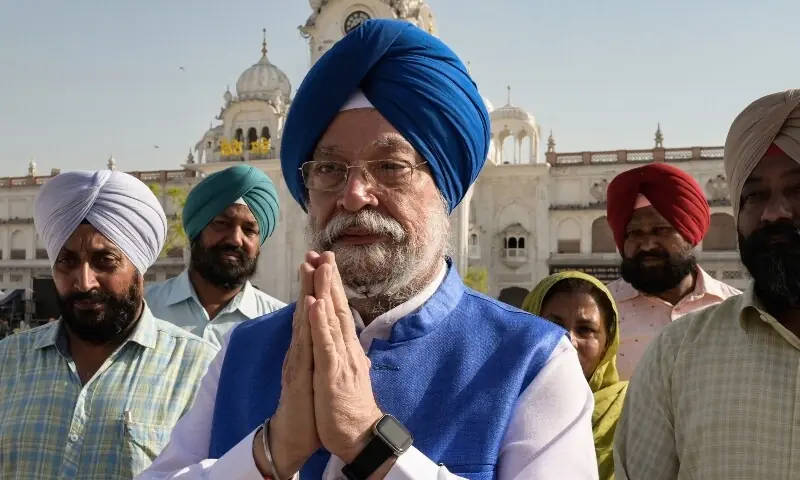 Minister of petroleum and natural gas & housing and urban affairs, Hardeep Singh Puri (C) gestures during his visit at the Golden temple in Amritsar on May 15, 2023. — AFP Minister of petroleum and natural gas & housing and urban affairs, Hardeep Singh Puri (C) gestures during his visit at the Golden temple in Amritsar on May 15, 2023. — AFP
