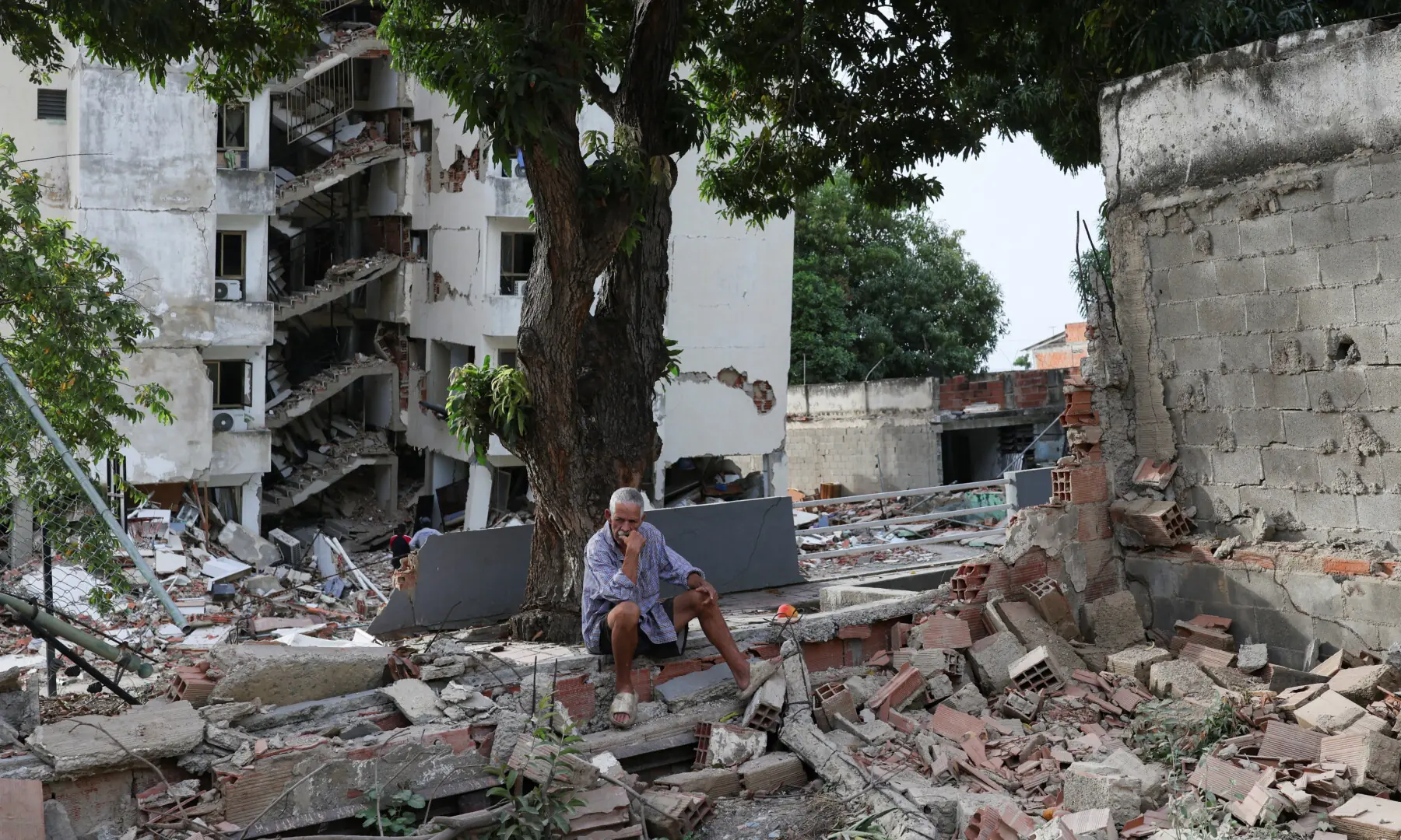 A man sits amidst debris next to damaged buildings in the aftermath of the June 24 earthquakes, in La Guaira, Venezuela, on July 4, 2026. — Reuters A man sits amidst debris next to damaged buildings in the aftermath of the June 24 earthquakes, in La Guaira, Venezuela, on July 4, 2026. — Reuters