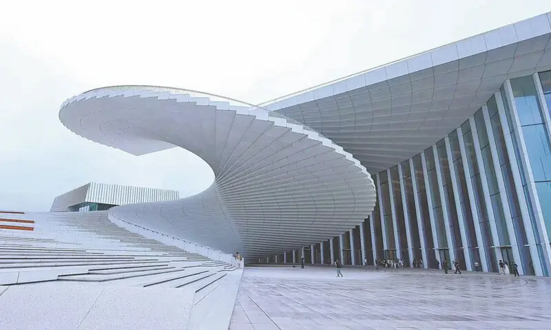The spiral staircase is at the visual heart of the architecture.—Courtesy China Daily The spiral staircase is at the visual heart of the architecture.—Courtesy China Daily