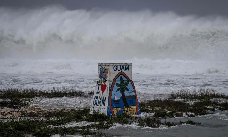 High waves crash against the coastline at a beach as the forecasted Super Typhoon Bavi approaches in Guam on July 5, 2026. —AFP